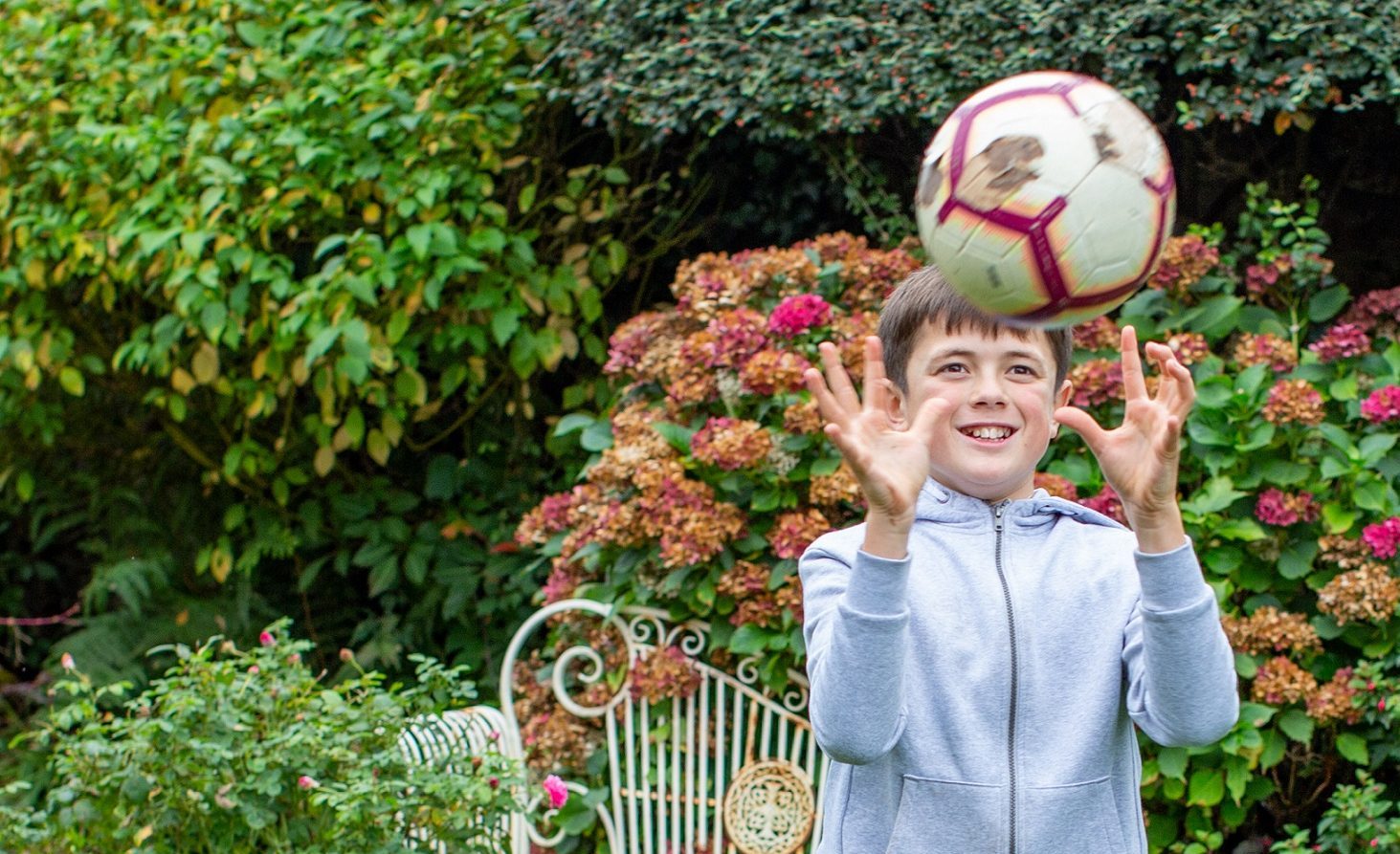 Boy catching football