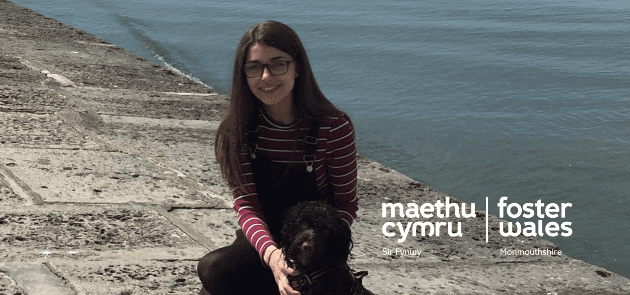 young girl and dog at a water front
